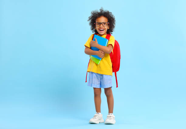 School kid with book and bag